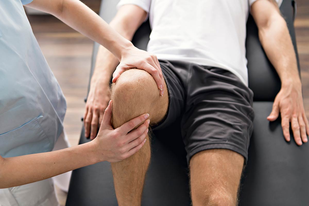 A young man being treated for a sports injury
